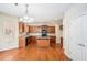Well-appointed kitchen with wooden cabinets, an island, granite countertops, and stainless steel appliances at 2134 Shropshire Se Ln, Atlanta, GA 30316
