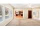 Open concept living room leading to a kitchen with wood cabinets and an island; lots of natural light at 2134 Shropshire Se Ln, Atlanta, GA 30316