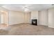 Spacious living room with a fireplace, neutral carpeting, and ample room for entertaining guests at 2134 Shropshire Se Ln, Atlanta, GA 30316