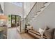 Charming foyer with double doors, a bench with throw pillows, and stairs with wood treads and iron railings at 2595 Apple Valley Rd, Brookhaven, GA 30319