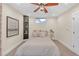 Charming bedroom featuring light carpeting, a ceiling fan, and unique shelving at 3637 Elm St, Atlanta, GA 30354