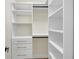 Well-organized walk-in closet with custom shelving, drawers, and hanging rods for ample storage at 3637 Elm St, Atlanta, GA 30354