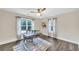 Bright home office with natural light, dark wood floors, and a stylish rug creating an inviting workspace at 3637 Elm St, Atlanta, GA 30354