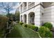 This backyard features manicured landscaping, elegant stone columns and a quaint place to sit and relax at 2440 Peachtree Nw Rd # 1, Atlanta, GA 30305
