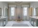 Bright bathroom with dual vanities, large windows, and a stylish decorative sculpture at 2440 Peachtree Nw Rd # 1, Atlanta, GA 30305
