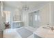 Spa-like bathroom featuring a glass enclosed shower, dual vanities, and modern fixtures at 2440 Peachtree Nw Rd # 1, Atlanta, GA 30305
