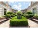 Beautiful courtyard with manicured hedges, benches, and stunning building facades at 2440 Peachtree Nw Rd # 1, Atlanta, GA 30305