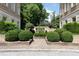 Well-maintained courtyard with manicured bushes, brick pathways, and lush greenery, creating a tranquil setting at 2440 Peachtree Nw Rd # 1, Atlanta, GA 30305