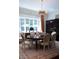 Formal dining room featuring hardwood floors, large windows, and designer lighting fixture at 2440 Peachtree Nw Rd # 1, Atlanta, GA 30305