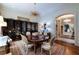 Formal dining room with unique chandelier, large table, and an ornate screen at 2440 Peachtree Nw Rd # 1, Atlanta, GA 30305