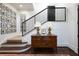 Foyer entryway featuring a chest of drawers, decorated stairwell, and wooden floors at 2440 Peachtree Nw Rd # 1, Atlanta, GA 30305