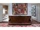 Wide hallway with a marble-topped console table, flanked by doorways and adorned with artwork at 2440 Peachtree Nw Rd # 1, Atlanta, GA 30305