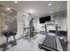 Home gym featuring a treadmill, free weights, pull-up bar, and mirrored wall at 2440 Peachtree Nw Rd # 1, Atlanta, GA 30305
