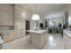 Gourmet kitchen boasts an island, wine fridge, and stainless appliances; perfect for entertaining at 2440 Peachtree Nw Rd # 1, Atlanta, GA 30305