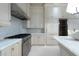 Gourmet kitchen featuring marble countertops and professional grade range at 2440 Peachtree Nw Rd # 1, Atlanta, GA 30305