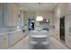 Modern kitchen featuring white marble countertops, custom cabinets, and stainless steel appliances at 2440 Peachtree Nw Rd # 1, Atlanta, GA 30305
