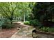 Beautiful landscaping features mature trees, stone pathways, and lush greenery, offering a peaceful outdoor experience at 2440 Peachtree Nw Rd # 1, Atlanta, GA 30305