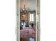 Comfortable living room with high ceilings, modern chandelier, and bold area rug at 2440 Peachtree Nw Rd # 1, Atlanta, GA 30305