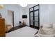 Living room featuring a small sofa, a table with a lamp, and hardwood floors at 2440 Peachtree Nw Rd # 1, Atlanta, GA 30305