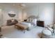 Spacious main bedroom with detailed trim, neutral tones, a tufted headboard, and stylish furnishings at 2440 Peachtree Nw Rd # 1, Atlanta, GA 30305