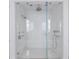 Modern glass-enclosed shower with dual shower heads, sleek fixtures, and tiled walls at 2440 Peachtree Nw Rd # 1, Atlanta, GA 30305