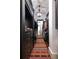 Hallway walk-in closet with hanging rods, storage drawers, and a large floor runner at 2440 Peachtree Nw Rd # 1, Atlanta, GA 30305