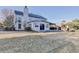 Large backyard with a view of the home's exterior, patio, and outdoor fireplace at 3550 Lakeheath Dr, Cumming, GA 30041