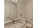 Half bathroom featuring neutral colors and a bright vanity at 3550 Lakeheath Dr, Cumming, GA 30041