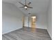 Primary bedroom with hardwood floors and attached bathroom at 3550 Lakeheath Dr, Cumming, GA 30041