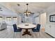 Bright dining room with wood floors, modern lighting and seating for two at 3550 Lakeheath Dr, Cumming, GA 30041