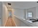 Upstairs hallway with hardwood floors and natural lighting at 3550 Lakeheath Dr, Cumming, GA 30041