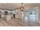 Open concept kitchen with granite countertops and stainless steel appliances at 3550 Lakeheath Dr, Cumming, GA 30041