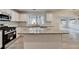 Spacious kitchen with stainless steel appliances, granite countertops, and large island at 3550 Lakeheath Dr, Cumming, GA 30041