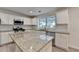 Modern kitchen with granite countertops, stainless steel appliances, and ample cabinet space at 3550 Lakeheath Dr, Cumming, GA 30041