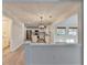 Open concept kitchen with stainless steel appliances and a breakfast bar at 3550 Lakeheath Dr, Cumming, GA 30041