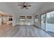 Spacious living room with a view to the kitchen and access to a deck at 3550 Lakeheath Dr, Cumming, GA 30041