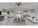 Spacious living room with neutral tones, a large window, and a backyard pool at 3550 Lakeheath Dr, Cumming, GA 30041