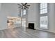 Inviting living room featuring a fireplace, high ceilings, and an open floor plan at 3550 Lakeheath Dr, Cumming, GA 30041
