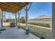 View of the backyard from covered patio with view of manicured lawn at 6187 Kelly Carlin Way, Norcross, GA 30071