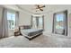 Spacious main bedroom with tray ceiling, large windows, and plush carpet at 6187 Kelly Carlin Way, Norcross, GA 30071