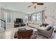 Comfortable living room showcasing large windows, plush seating, modern decor, and a bright, airy atmosphere at 6187 Kelly Carlin Way, Norcross, GA 30071