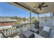 Relaxing covered patio with comfortable seating, a grill, and a ceiling fan at 6187 Kelly Carlin Way, Norcross, GA 30071