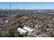 Aerial view featuring property location near Atlantic Station, showcasing lush trees and city skyline at 1110 Briar Cove Cir, Atlanta, GA 30329