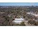 Buckhead aerial view showcases modern townhomes surrounded by lush trees and city skyline in the background at 1110 Briar Cove Cir, Atlanta, GA 30329