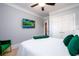 Bedroom featuring gray walls, tan carpet, with green velvet accents at 1110 Briar Cove Cir, Atlanta, GA 30329