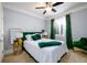 Bedroom featuring gray walls, tan carpet, with green bedspread and natural light at 1110 Briar Cove Cir, Atlanta, GA 30329