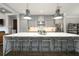 Open kitchen with modern stainless steel appliances, island seating and hardwood floors at 1110 Briar Cove Cir, Atlanta, GA 30329
