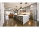 Large open concept kitchen featuring a white island with seating and hardwood floors at 1110 Briar Cove Cir, Atlanta, GA 30329
