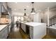 Modern kitchen with a white island, gray cabinets, stainless appliances, and dark hardwood floors at 1110 Briar Cove Cir, Atlanta, GA 30329