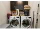 Modern laundry room featuring front-loading washer and dryer at 1110 Briar Cove Cir, Atlanta, GA 30329